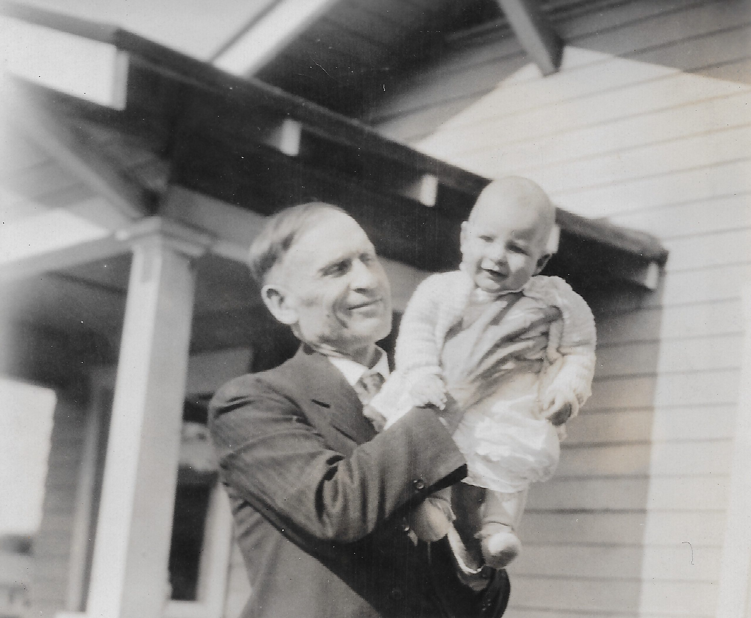 Dad holding Roy Luciles baby